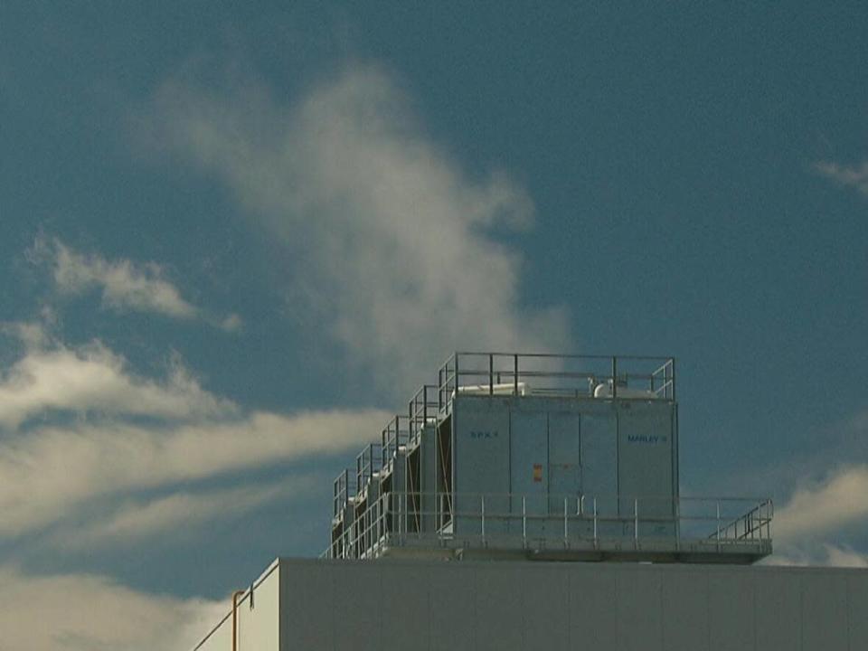 There are about 500 cooling towers, like these shown on an industrial building in Moncton, across the province.  (Pierre Fournier/CBC - image credit)