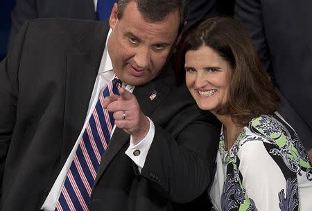 Governor Chris Christie (L) talks to his wife Mary Pat Christie after he was sworn in for his second term at the War Memorial Theatre in Trenton, New Jersey January 21, 2014. REUTERS/Carlo Allegri