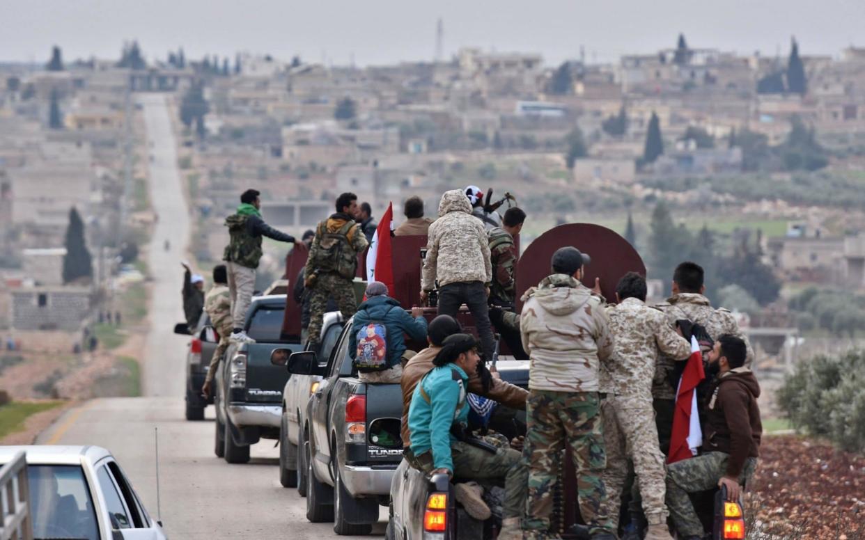 A convoy of pro-Syrian government fighters arrived in Syria's northern region of Afrin to fight Turkey. - AFP