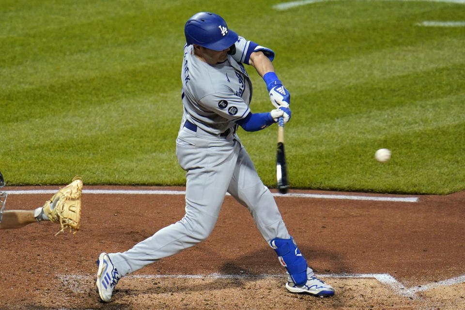 Los Angeles Dodgers' AJ Pollock hits an RBI double off Pittsburgh Pirates starting pitcher JT Brubaker during the fifth inning of a baseball game in Pittsburgh, Tuesday, June 8, 2021. (AP Photo/Gene J. Puskar)