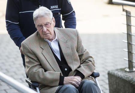 Defendant Reinhold Hanning, a 94-year-old former guard at Auschwitz death camp, is brought to courtroom on a wheelchair before the continuation of his trial in Detmold, Germany, April 28, 2016. REUTERS/Bernd Thissen/Pool