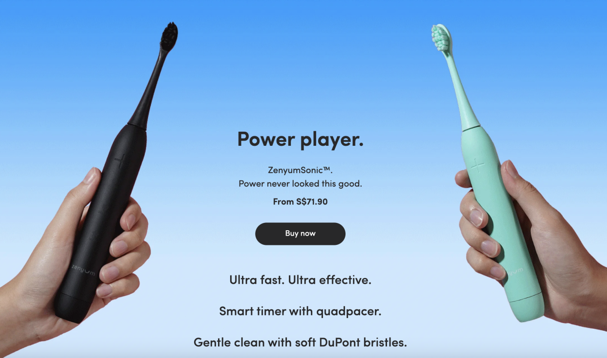Two hands holding the Zenyum electric toothbrushes in black and green