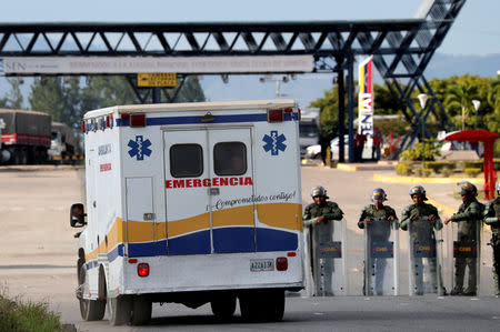 FILE PHOTO: An indigenous man looks outside of an ambulance as it passes next to Venezuelan National guards at the border between Venezuela and Brazil, in Pacaraima, Roraima state, Brazil, February 22, 2019. REUTERS/Ricardo Moraes/File Photo