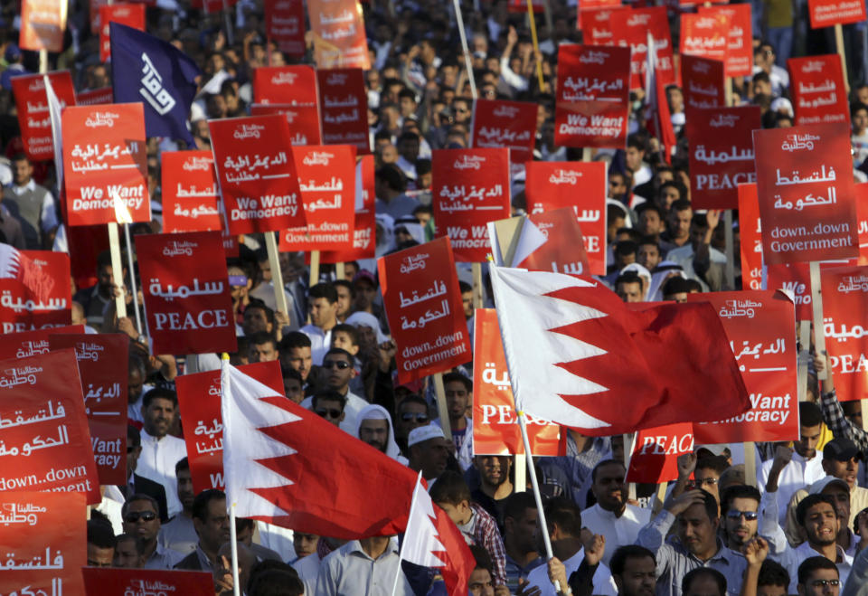 FILE - Tens of thousands of Bahraini anti-government protesters participate in a rally Friday, Nov. 25, 2011, in Maqsha, Bahrain. Hackers said they had taken down the website of Bahrain's international airport on Tuesday, Feb. 14, 2023, to mark the 12-year anniversary of an Arab Spring uprising in the small Gulf country. (AP Photo/Hasan Jamali, File)