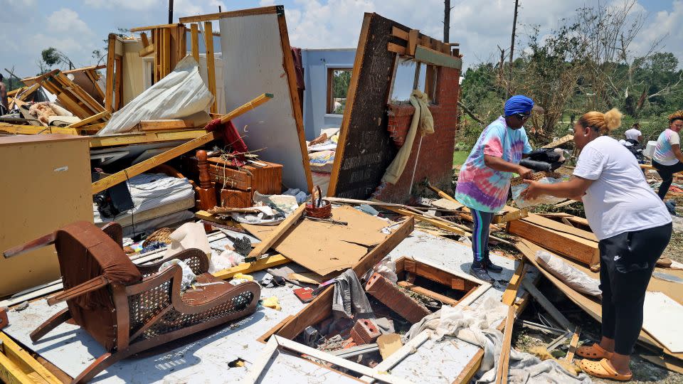 Belongings are removed from a tornado-damaged home on June 19 in Louin, Mississippi. - Michael DeMocker/Getty Images