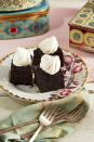 <p>Treat your Christmas guests to a sweet after-dinner bite that is absolutely heavenly. Rich molasses, candied ginger, and all the winter spices give these moist cakes oodles of flavor.</p><p><strong><a href="https://www.countryliving.com/food-drinks/a38095519/ginger-cake-squares-with-chantilly-cream-recipe/" rel="nofollow noopener" target="_blank" data-ylk="slk:Get the recipe for Ginger Cake Squares with Chantilly Cream;elm:context_link;itc:0;sec:content-canvas" class="link ">Get the recipe for Ginger Cake Squares with Chantilly Cream</a>.</strong></p>