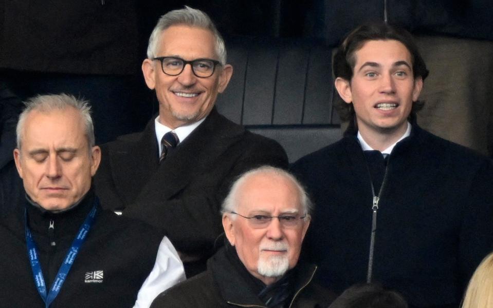 Former player and TV presenter Gary Lineker is pictured with his son in the stands before the match - - Reuters/Toby Melville