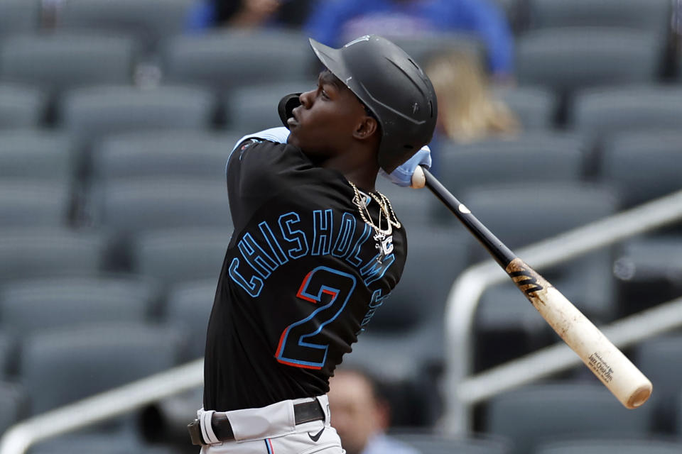 Miami Marlins' Jazz Chisholm Jr. hits a run scoring ground rule double against the New York Mets during the fifth inning of the first game of a baseball doubleheader that started April 11 and was suspended because of rain, Tuesday, Aug. 31, 2021, in New York. (AP Photo/Adam Hunger)