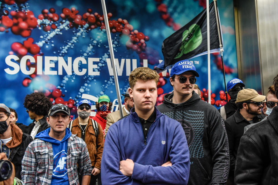 NEW YORK, NY - NOVEMBER 13: People associated with the far-right group America First attend an anti-vaccine protest in front of Pfizer world headquarters on November 13, 2021 in New York City. A U.S. Circuit Court granted an emergency stay to temporarily stop the Biden administration's vaccine requirement for businesses with 100 or more workers as many feel it is an unlawful overreach. (Photo by Stephanie Keith/Getty Images)