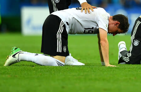 Soccer Football - World Cup - Group F - Germany vs Sweden - Fisht Stadium, Sochi, Russia - June 23, 2018 Germany's Sebastian Rudy receives treatment from medical staff after sustaining an injury REUTERS/Dylan Martinez