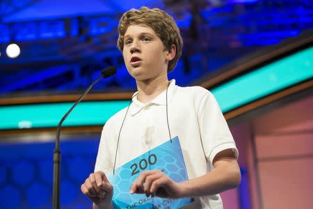 Cole Shafer-Ray of Oklahoma City, Oklahoma, spells "commissurotomy" during the final round of the 88th annual Scripps National Spelling Bee at National Harbor, Maryland May 28, 2015. REUTERS/Joshua Roberts