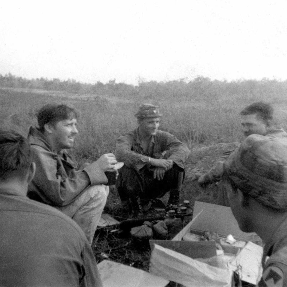 John ‘Chick’ Donohue (second from left) catching up with his friend Sgt. Rick Duggan (third from left) in Vietnam