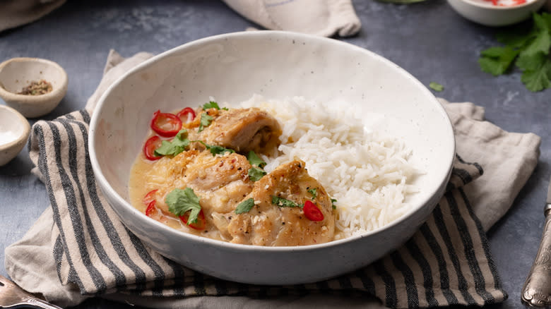 coconut lime chicken thighs with rice in bowl