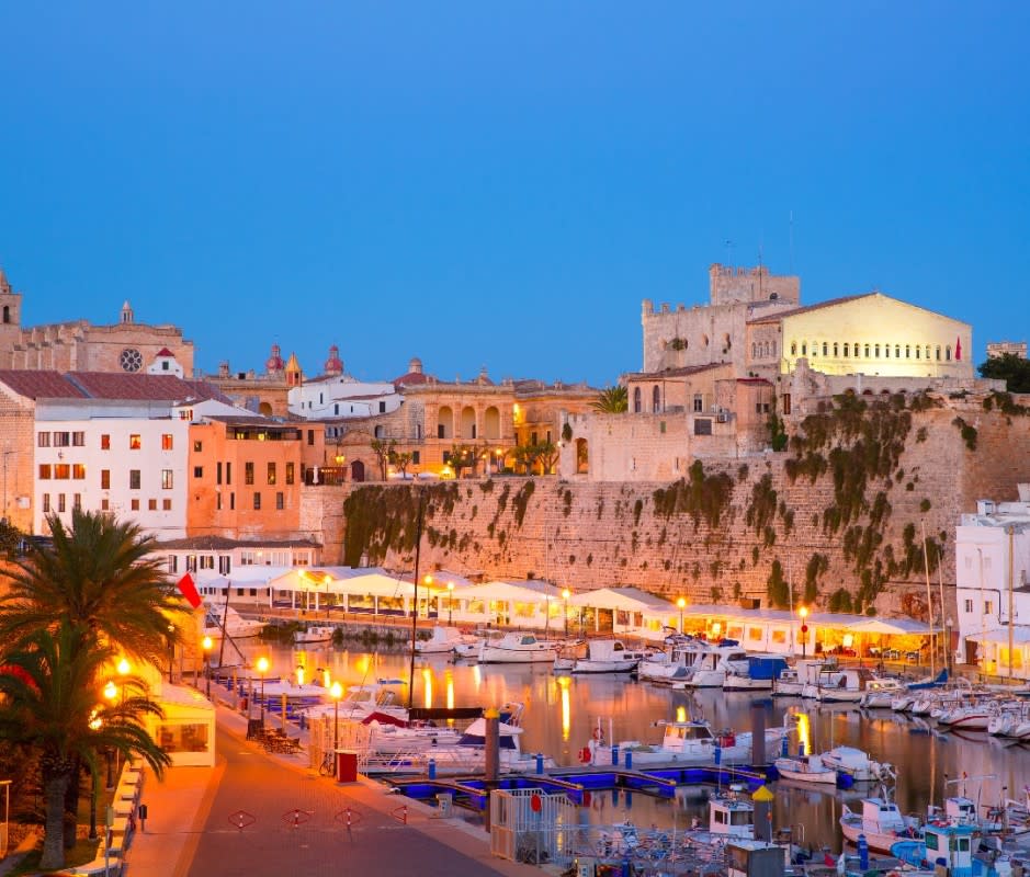 Harboring the island's westernmost point, Menorca's former capital <em>Ciutadella</em> remains its most photogenic, historic port. <p>LUNAMARINA/Getty Images</p>