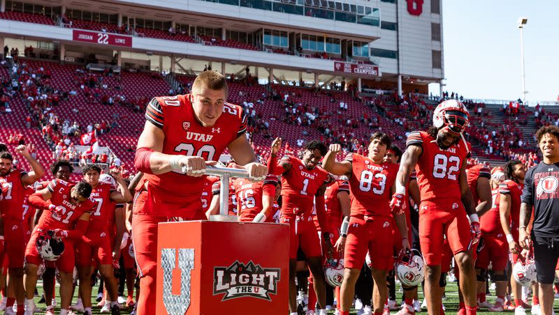 Utah Utes linebacker Lander Barton (20) lights the U after their victory over the Weber State Wildcats at Rice-Eccles Stadium in Salt Lake City on Saturday, Sept. 16, 2023. The Utah Utes won the game with a final score of 31-7.