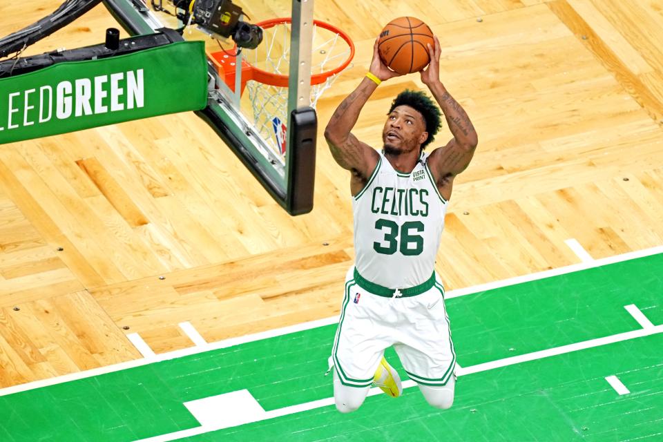 Marcus Smart dunks the ball during Game 4 against the Golden State Warriors.
