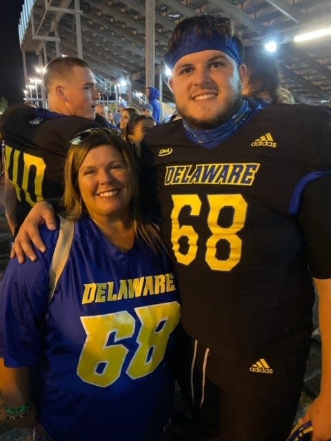 Delaware long snapper Jake Reed and his mom Traci after a recent game.