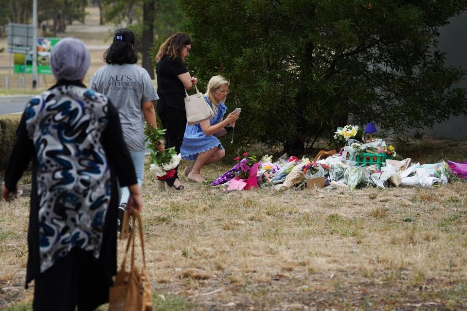 People lay flowers in tribute for Aiia Maasarwe (EPA)