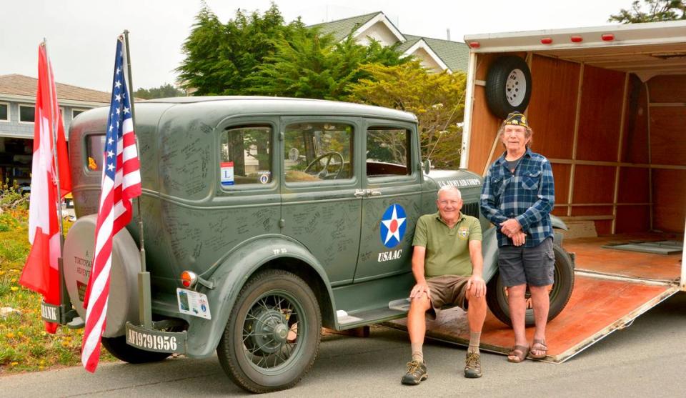 Jay Burbank of Cambria, at left, and Charlie Enxuto of South Carolina take a pause Friday, June 9, 2023, before they load Burbank’s 1931 Model A town sedan, a cartop tent, fuel cans and more into the trailer before departing Saturday, June 10, 2023 for their 7,000-mile roundtrip adventure to Tuktoyaktuk on the Arctic Ocean. They’ll drive one-fifth of the journey in the antique vehicle on the graveled Dempster Highway.