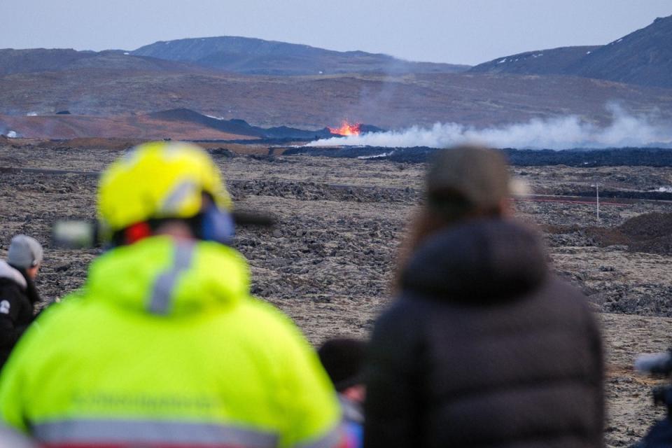 Lava explosions and rising smoke from a crack in the ground close to the town of Grindavik (EPA)