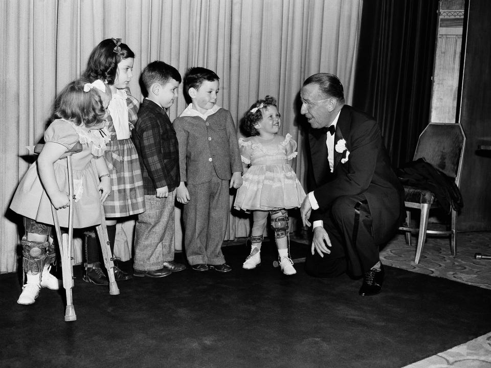 5 children with polio meet Basil O'Connor, president of the Infantile Paralysis, during a ceremony for his 60th birthday.