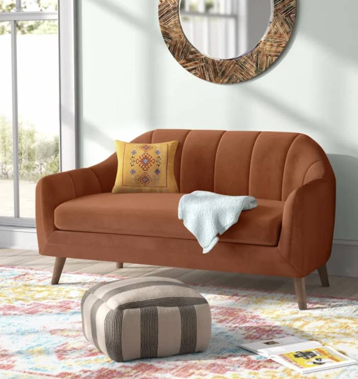 the loveseat in burnt orange