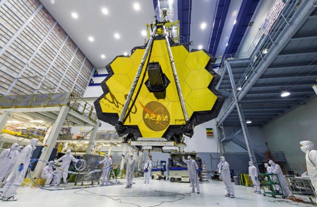 NASA technicians lift mirror of the James Webb Space Telescope using a crane