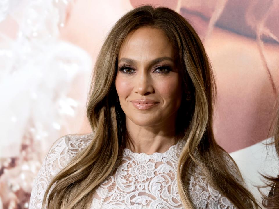 Jennifer Lopez in a lacy white dress