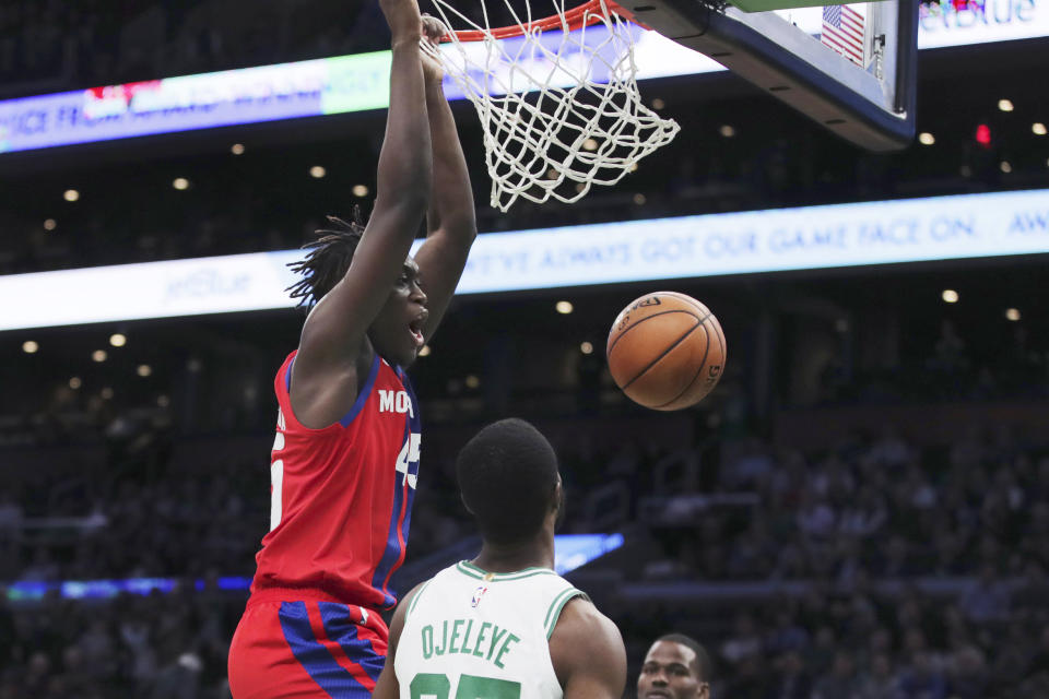 Detroit Pistons forward Sekou Doumbouya dunks over Boston Celtics forward Semi Ojeleye (37) during the second half of an NBA basketball game in Boston, Wednesday, Jan. 15, 2020. (AP Photo/Charles Krupa)