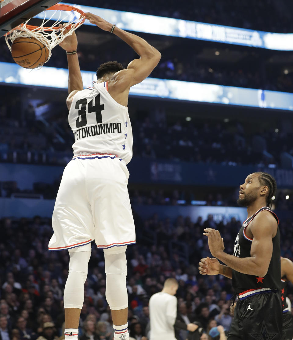 Team Giannis' Giannis Antetokounmpo, of the Milwaukee Bucks, dunks the ball against Team LeBron during the first half of an NBA All-Star basketball game, Sunday, Feb. 17, 2019, in Charlotte, N.C. (AP Photo/Chuck Burton)