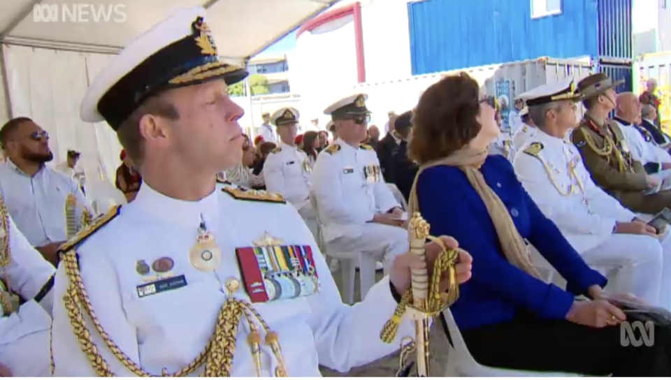 Officials in the crowd during the ceremony.