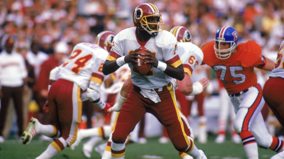 Doug Williams was the first Black quarterback to lead his NFL team to Super Bowl glory, in the 1987-1988 season. - Rick Stewart/Getty Images