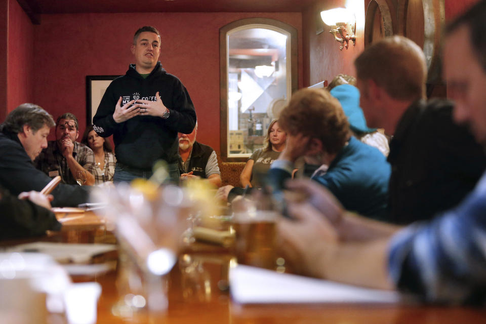 In this photo taken Tuesday, Dec. 11, 2018, Jeff Okrepkie, founder of Coffey Strong, along with other Tubbs Fire survivors talk with local service providers about working with fire survivors of the Camp Fire, in Chico, Calif. Survivors of a deadly wildfire that last year tore through California's wine country are sharing lessons of loss and pain but also of resilience with those who last month escaped the deadliest U.S. wildfire in at least a century. The Press Democrat reports a group of Sonoma County residents spent Tuesday in a packed meeting with residents of Paradise and several nearby communities who grilled them with questions. (Alvin Jornada/The Press Democrat via AP)