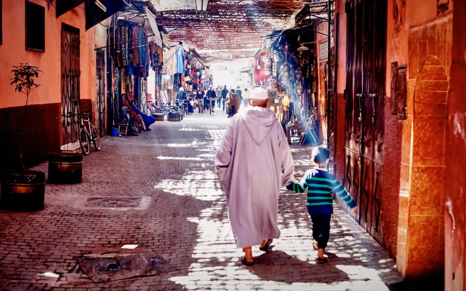 Grandfather and boy in Marrakech - Getty