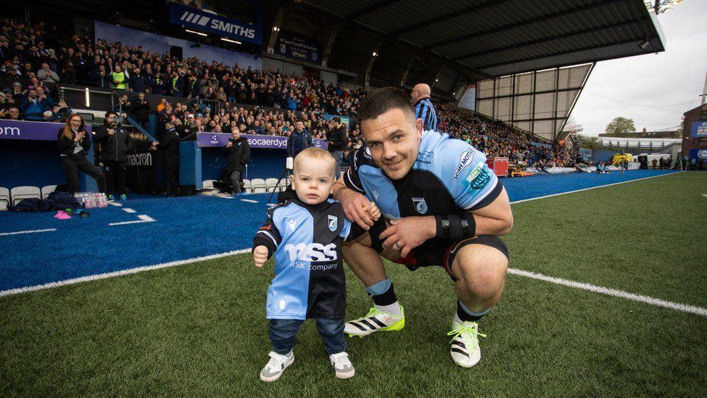 Ellis Jenkins and his baby son at the Arms Park