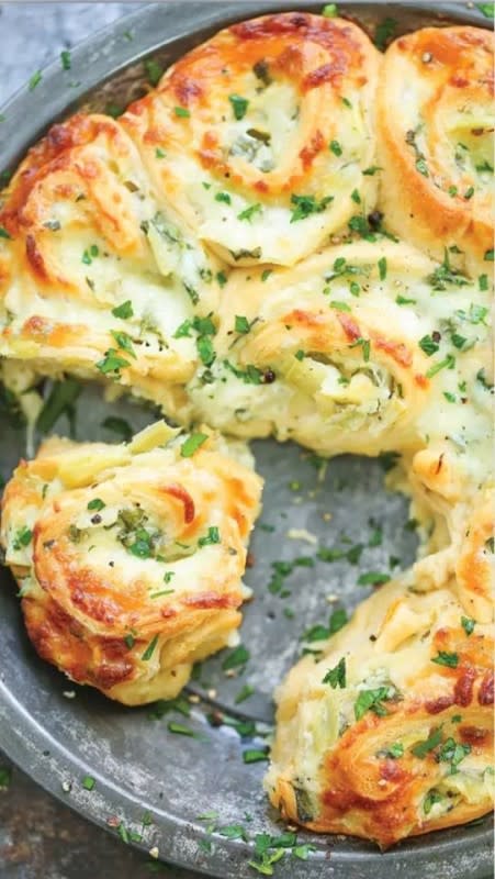 <p>Damn Delicious</p><p>These Pull-Apart Spinach and Artichoke Rolls transform everyone's favorite dip into a worthy bread course.</p><p><strong>Get the recipe: </strong><a href="https://damndelicious.net/2017/09/27/cheesy-spinach-and-artichoke-pinwheels/" rel="nofollow noopener" target="_blank" data-ylk="slk:Pull-Apart Spinach and Artichoke Rolls;elm:context_link;itc:0;sec:content-canvas" class="link rapid-noclick-resp"><strong>Pull-Apart Spinach and Artichoke Rolls</strong></a></p>