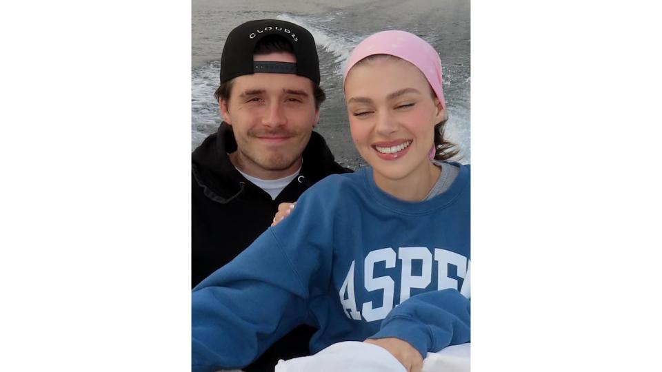 Nicola and Brookyln Beckham pose for a selfie on a boat