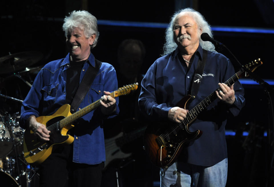 FILE - In this Oct. 2009 file photo, Graham Nash, left, and David Crosby of Crosby, Stills, and Nash perform at the 25th Anniversary Rock & Roll Hall of Fame concert at Madison Square Garden, in New York. Crosby has undergone heart surgery and he's postponing sold-out California shows. Publicist Michael Jensen tells City News Service on Monday, Feb. 17, 2014, that the 72-year-old Crosby had a cardiac catheterization last week to fix a blocked coronary artery. (AP Photo/Henny Ray Abrams, file)