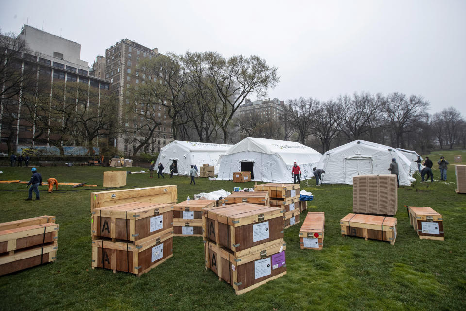 Image: A Samaritan's Purse crew works on building an emergency field hospital equipped with a respiratory unit in New York's Central Park across from the Mount Sinai Hospital (Mary Altaffer / AP)