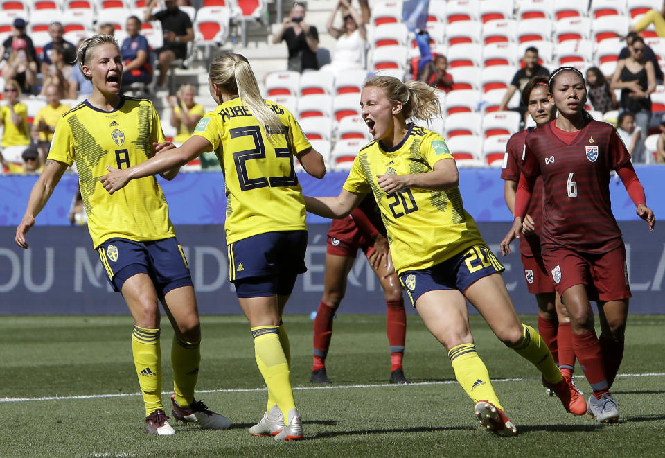 Sweden's Mimmi Larsson, front right, Sweden's scorer Elin Rubensson, front center, and Sweden's Lina Hurtig, left, celebrate their side's fifth goal during the Women's World Cup Group F soccer match between Sweden and Thailand at the Stade de Nice in Nice, France, Sunday, June 16, 2019. Sweden defeated Thailand by 5-1.(AP Photo/Claude Paris)