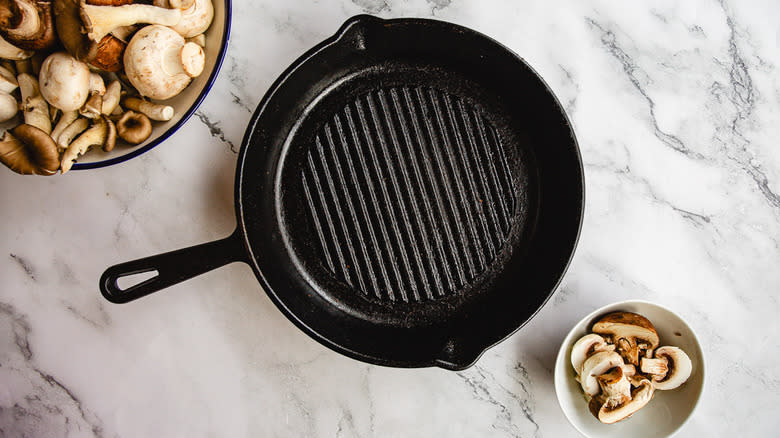 Hot pan beside mushrooms