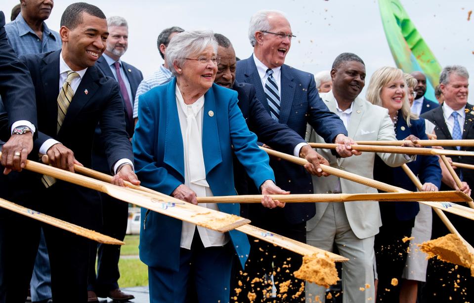 Montgomery Mayor Steven Reed, from left, Alabama Gov. Kay Ivey, Montgomery County Commission Chairman Elton Dean and other dignitaries take part in the groundbreaking ceremony for an whitewater park and outdoor fun center in Montgomery, Ala., on Thursday.