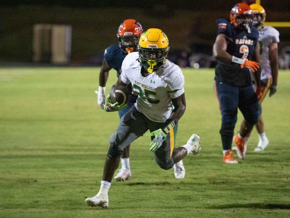 CJ Nettles (25) takes it in for a touchdown and a 12-0 Crusaders lead during the Pensacola Catholic vs Escambia football game at Escambia High School in Pensacola on Friday, Sept. 1, 2023.