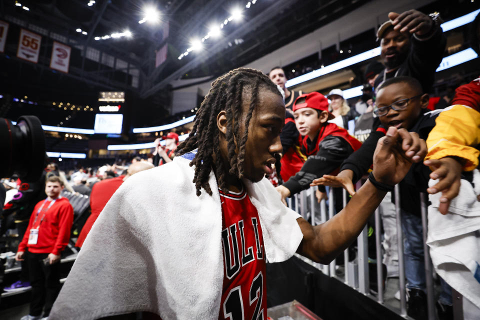 Chicago Bulls guard Ayo Dosunmu greets fans after an NBA basketball game against the Atlanta Hawks, Monday, Feb. 12, 2024, in Atlanta. (AP Photo/Alex Slitz)