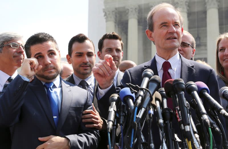 FILE PHOTO: Zarrillo wipes away his tears and Katami looks on, both plaintiffs in the case against California's gay marriage ban known as Prop 8, as attorney Boies talks to reporters outside the Supreme Court in Washington