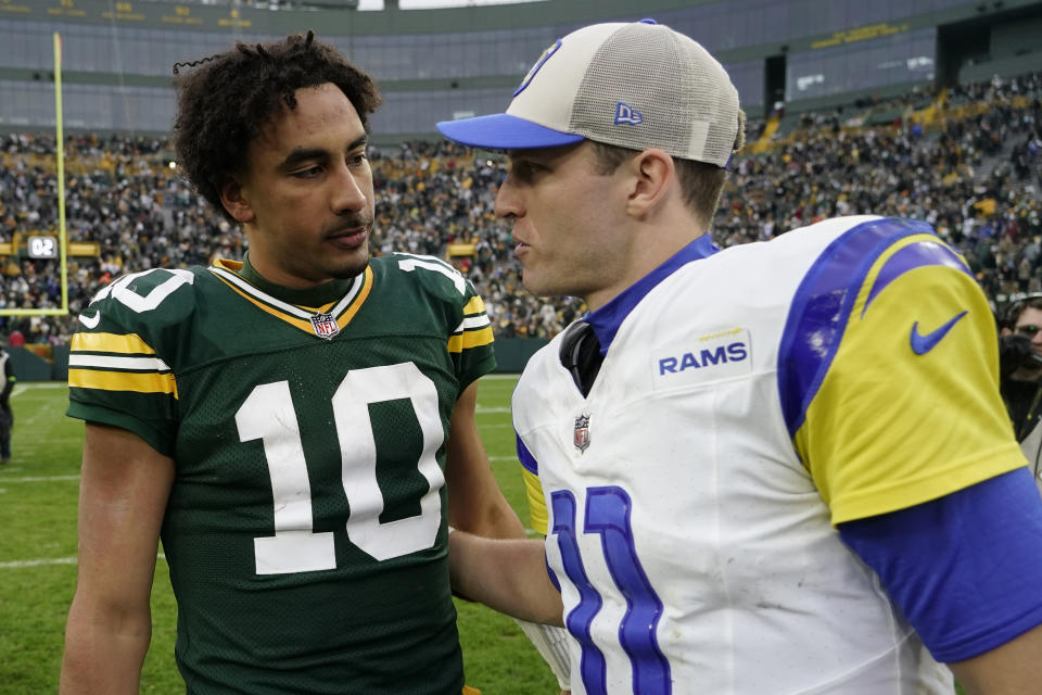 Green Bay Packers quarterback Jordan Love (10) and Los Angeles Rams quarterback Brett Rypien (11) talk after an NFL football game Sunday, Nov. 5, 2023, in Green Bay, Wis. The Packers won 20-3. (AP Photo/Morry Gash)