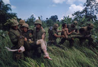 <p>Recovery of wounded under fire, near Hill 484, Operation Prairie, October 1966. (Photograph by Larry Burrows) </p>