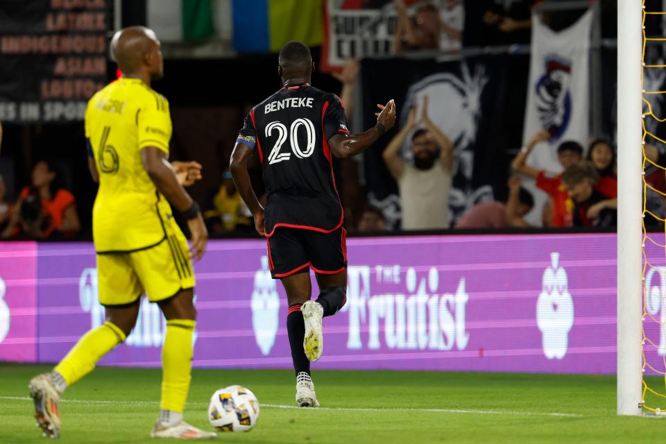 Sep 28, 2024; Washington, District of Columbia, USA; D.C. United forward Christian Benteke (20) celebrates after scoring a goal against the Columbus Crew in the first half at Audi Field. Mandatory Credit: Geoff Burke-Imagn Images