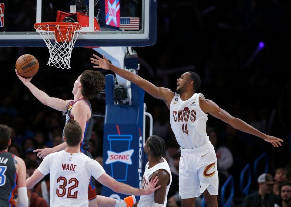 Oklahoma City's Josh Giddey (3) shoots a lay up as Cleveland's Evan Mobley (4) defends in the second half during the NBA basketball between the Oklahoma City Thunder and the Cleveland Cavaliers at the Paycom Center in Oklahoma City, Friday, Jan.27, 2023. 