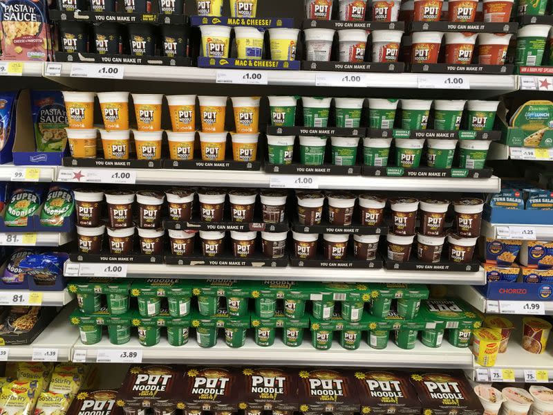 Pot Noodles are displayed for sale on shelves at a Tesco supermarket near Manchester